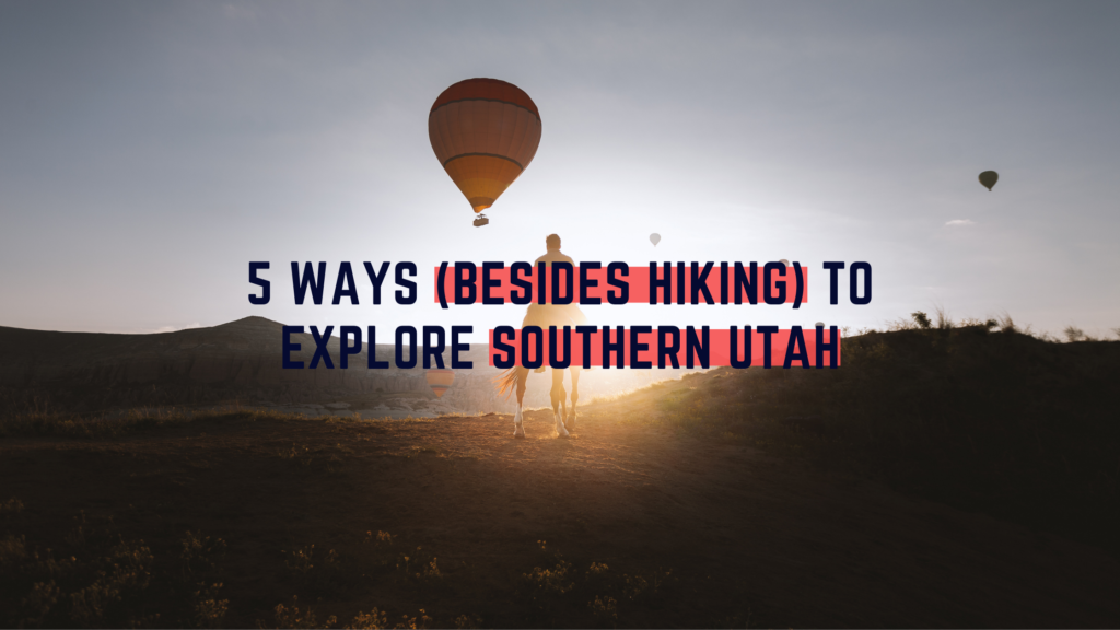 Hot air balloons over Southern Utah landscape at sunrise.