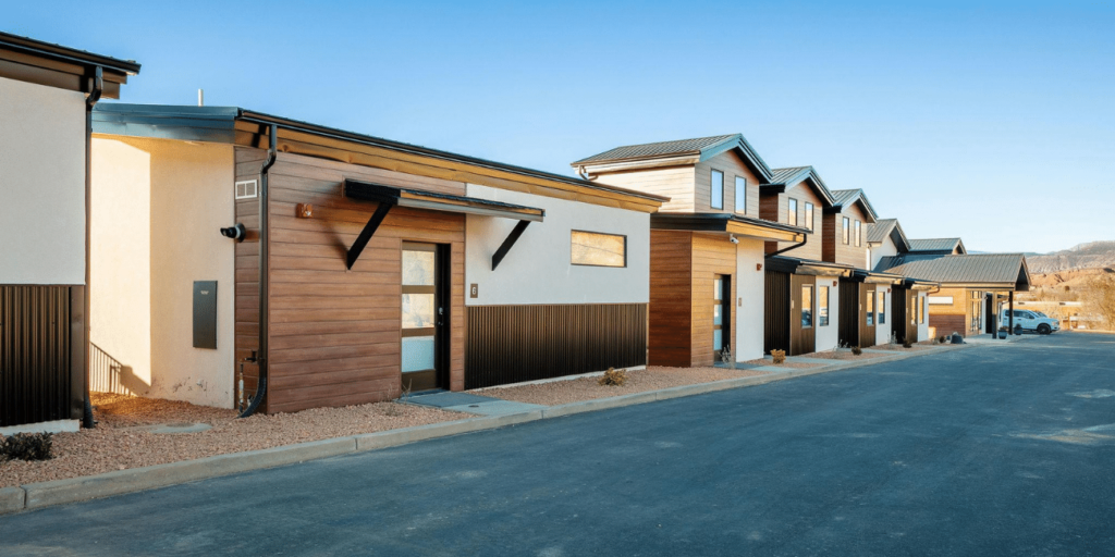 Modern suburban townhouses in daylight.