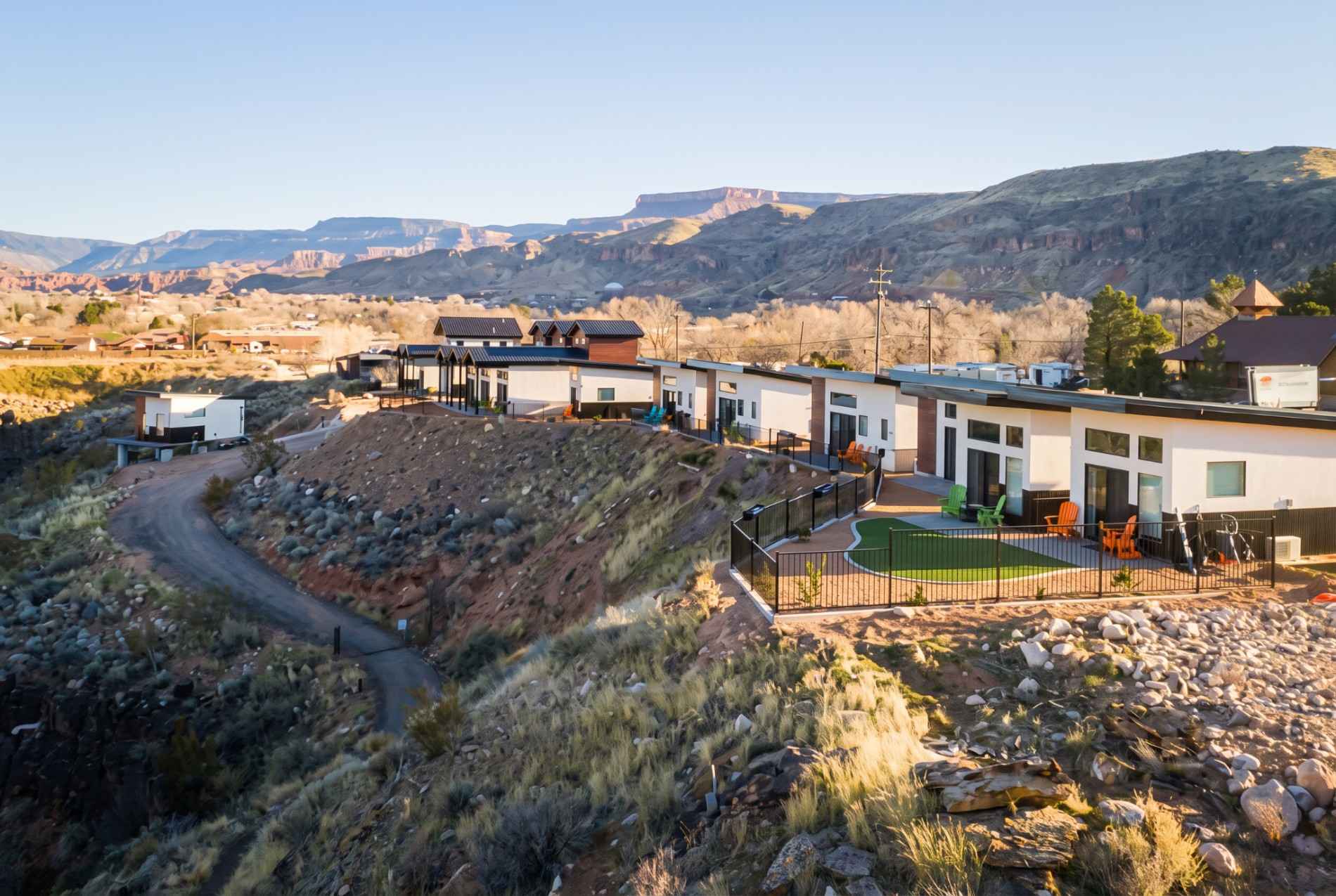 The Dwellings tiny homes in La Verkin, Utah, on a ridge with canyon views toward Zion National Park.