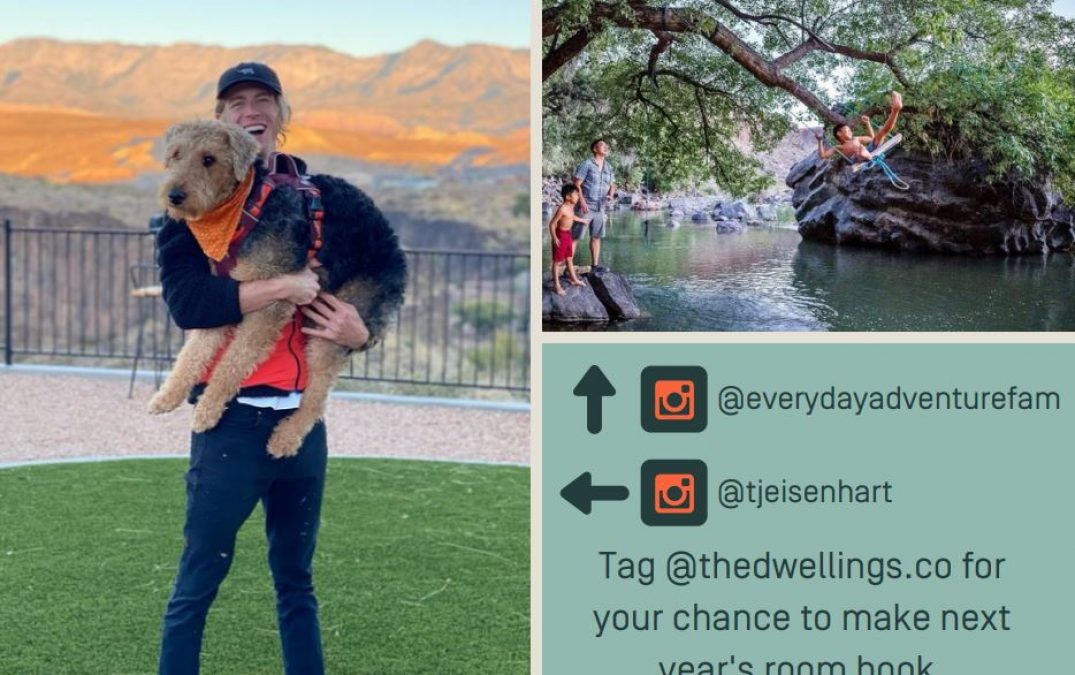Man holding dog with scenic mountain background.