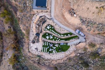 Aerial view of outdoor event space with arranged tables.