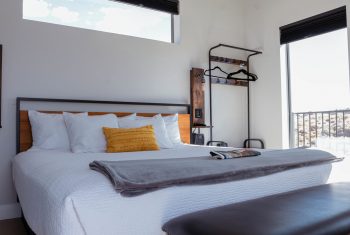 Modern bedroom with natural light and minimal decor.